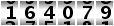 164079